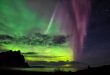 First place in the 2021 IAU OAE Astrophotography Contest, category Aurorae (still images): Multicolored aurora in Iceland, by Marco Migliardi on behalf of Associazione Astronomica Cortina, Italy. Aurorae are the result of ionisation and excitation processes in Earth's upper atmosphere, caused by charged particles from the solar wind or from coronal mass ejections. The different colours in an aurora display indicate the species of atmospheric atoms and molecules involved. The most common colour is a bright green, which, together with deep red, originates from atomic oxygen. Blue, purple and pink hues are much rarer and originate from molecular nitrogen. The reflection of the aurora in the water indicates the brightness of intense aurorae at higher latitudes. Link:  See image in Zenodo