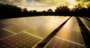 Solar array on parking area rooftop in Broward County, FL. Original public domain image from Flickr