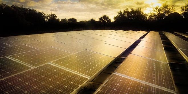 Solar array on parking area rooftop in Broward County, FL. Original public domain image from Flickr