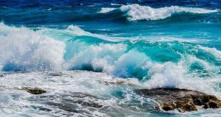 Deep blue and wavy sea view. Original public domain image from Wikimedia Commons